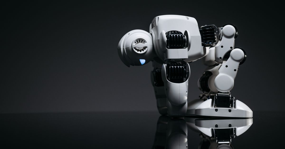 A modern robot toy depicted in a studio environment with its reflection visible on a dark surface.