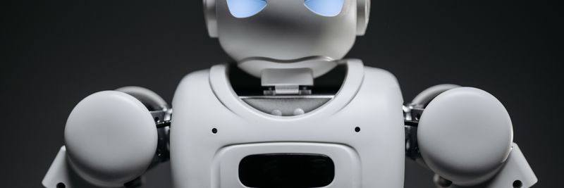 Detailed studio shot of a modern robotic toy with a dark background, showcasing technological design.