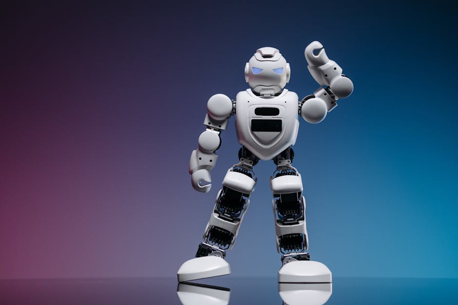 How Personal Capital Solves Net Worth Tracking for Busy Professionals A sleek white robot in a studio setting against a gradient background, showcasing modern robotics.