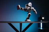 A White Robot with Leg Raised Sideways