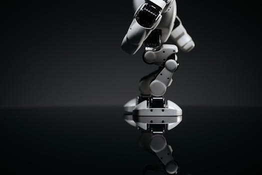 A close-up image of a mechanical robotic arm reflecting on a dark surface, capturing industrial innovation.
