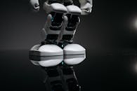 Close Up Shot of White Toy Robot