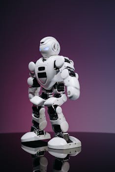 A futuristic white humanoid robot standing on a reflective surface against a gradient background.