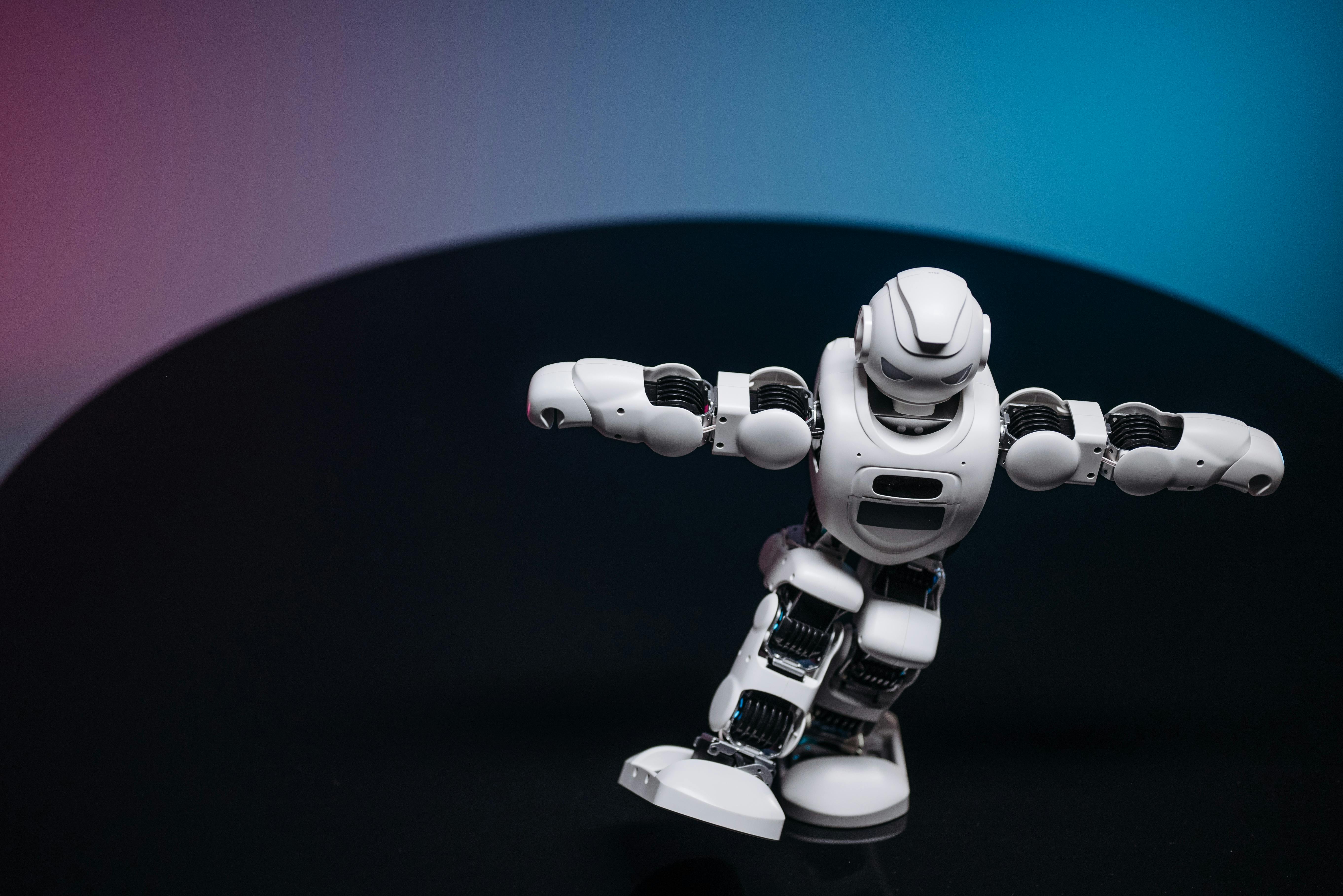 white toy robot on black surface