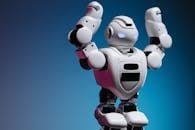 Close Up Shot of White Toy Robot in Blue Background