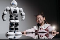 A Girl Looking at the White Toy Robot
