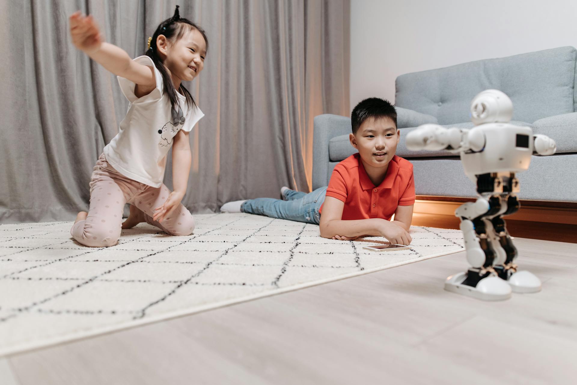 Kids Happily Looking at the Dancing Robot