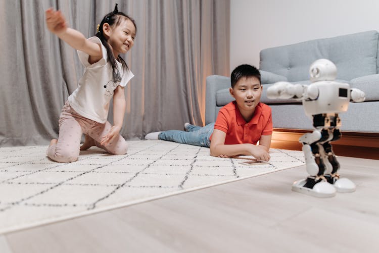 Kids Happily Looking At The Dancing Robot