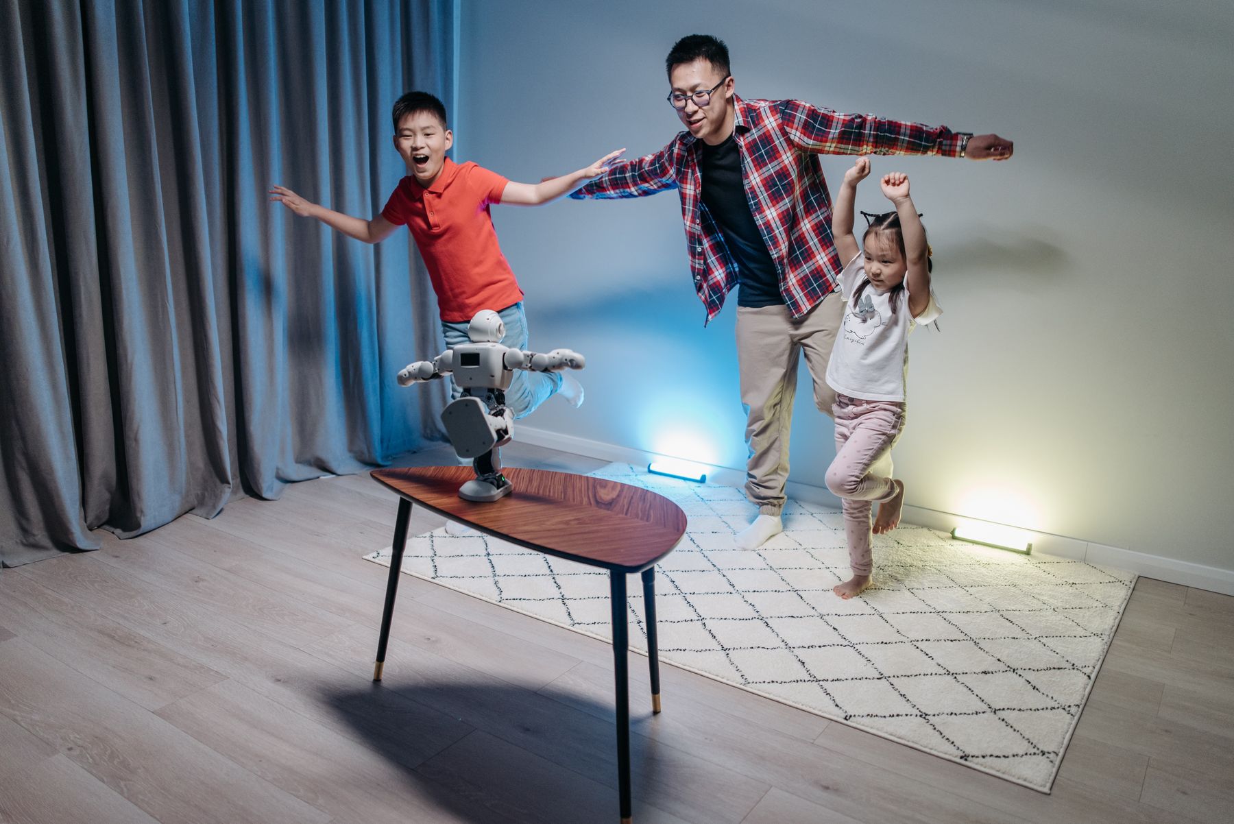 Family interacting with a small home robot