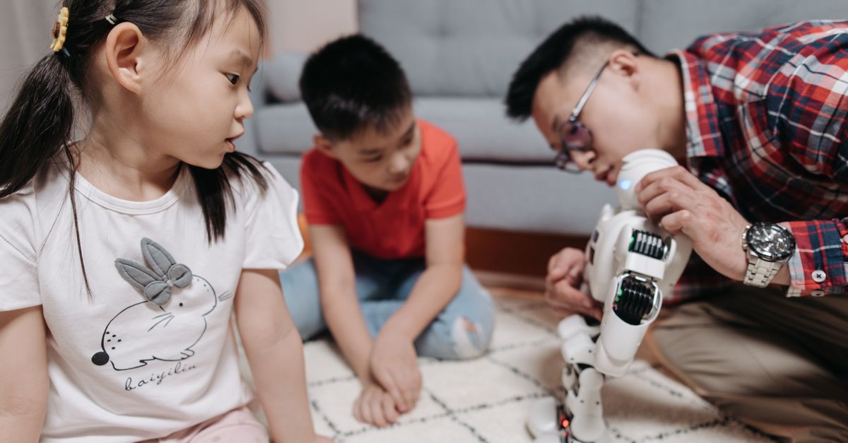a child building a robot with a parent, highlighting hands-on learning outside the classroom