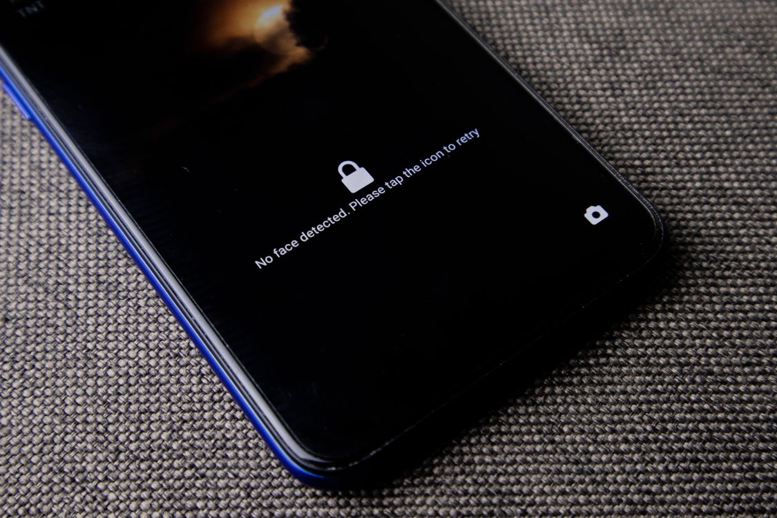 A smartphone lock screen on a textured surface.