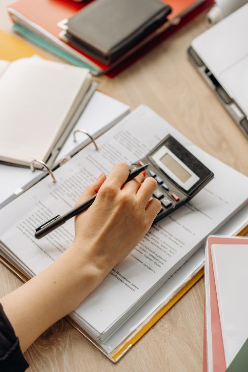 Calculator User A Person Using a Calculator · Free Stock Photo