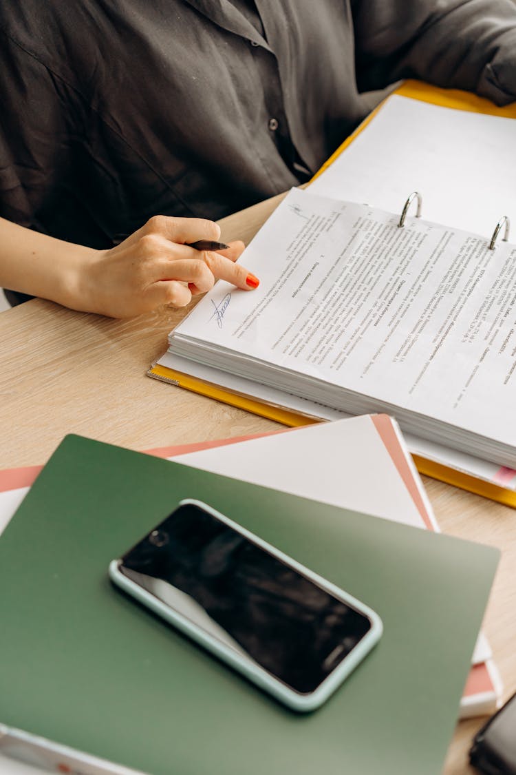 A Person Examining Documents