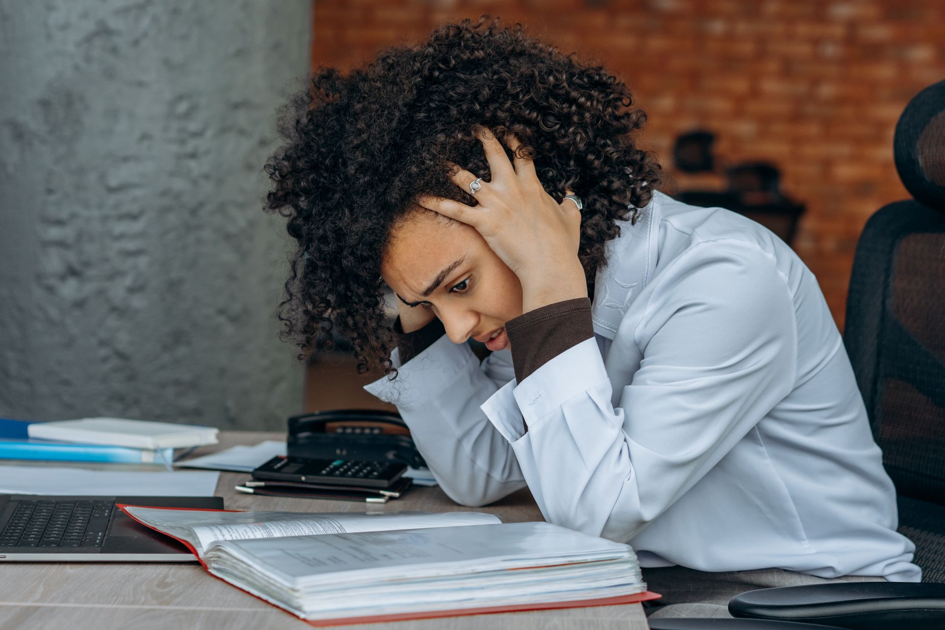 A Woman Sitting in the Office