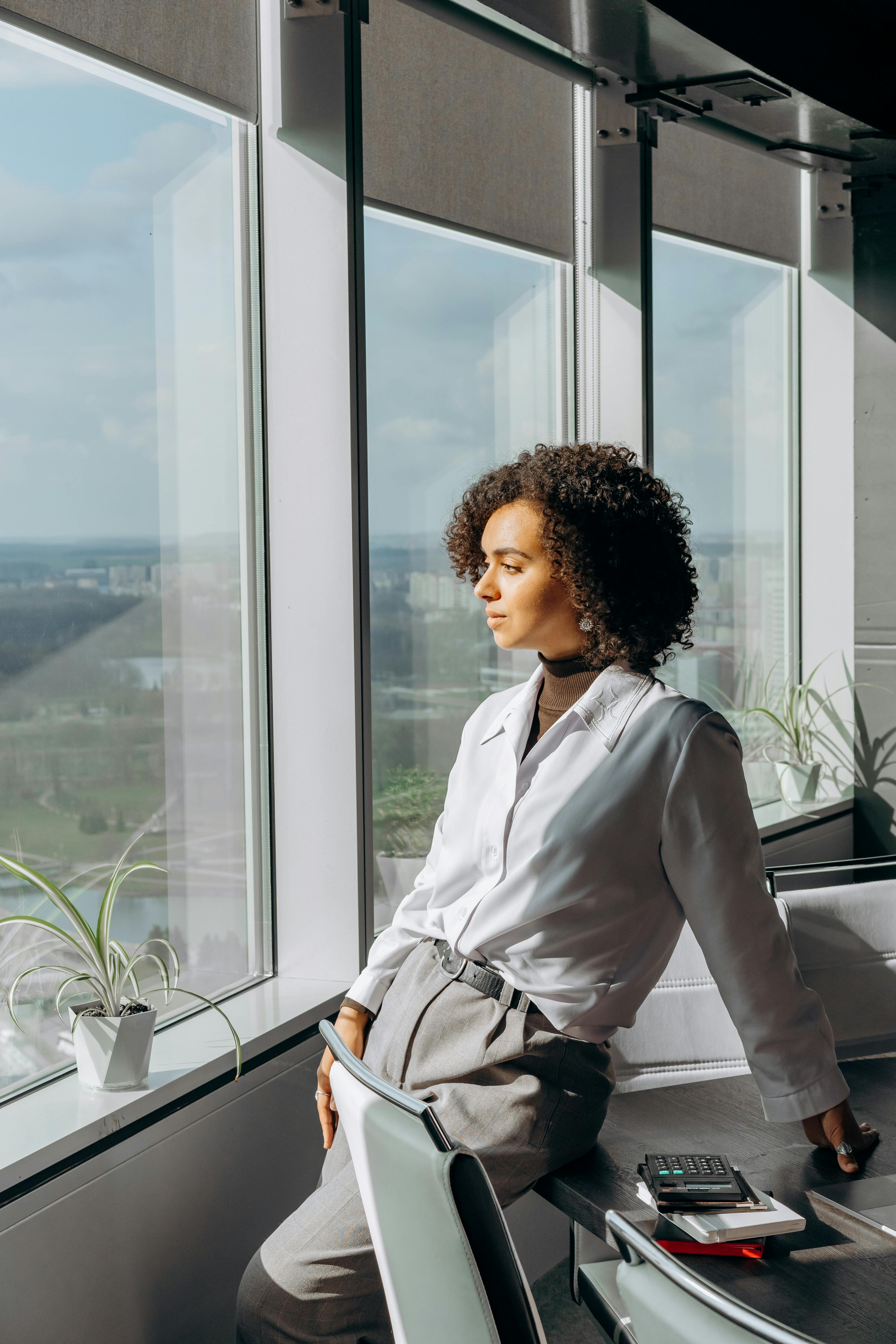 a woman standing in the office