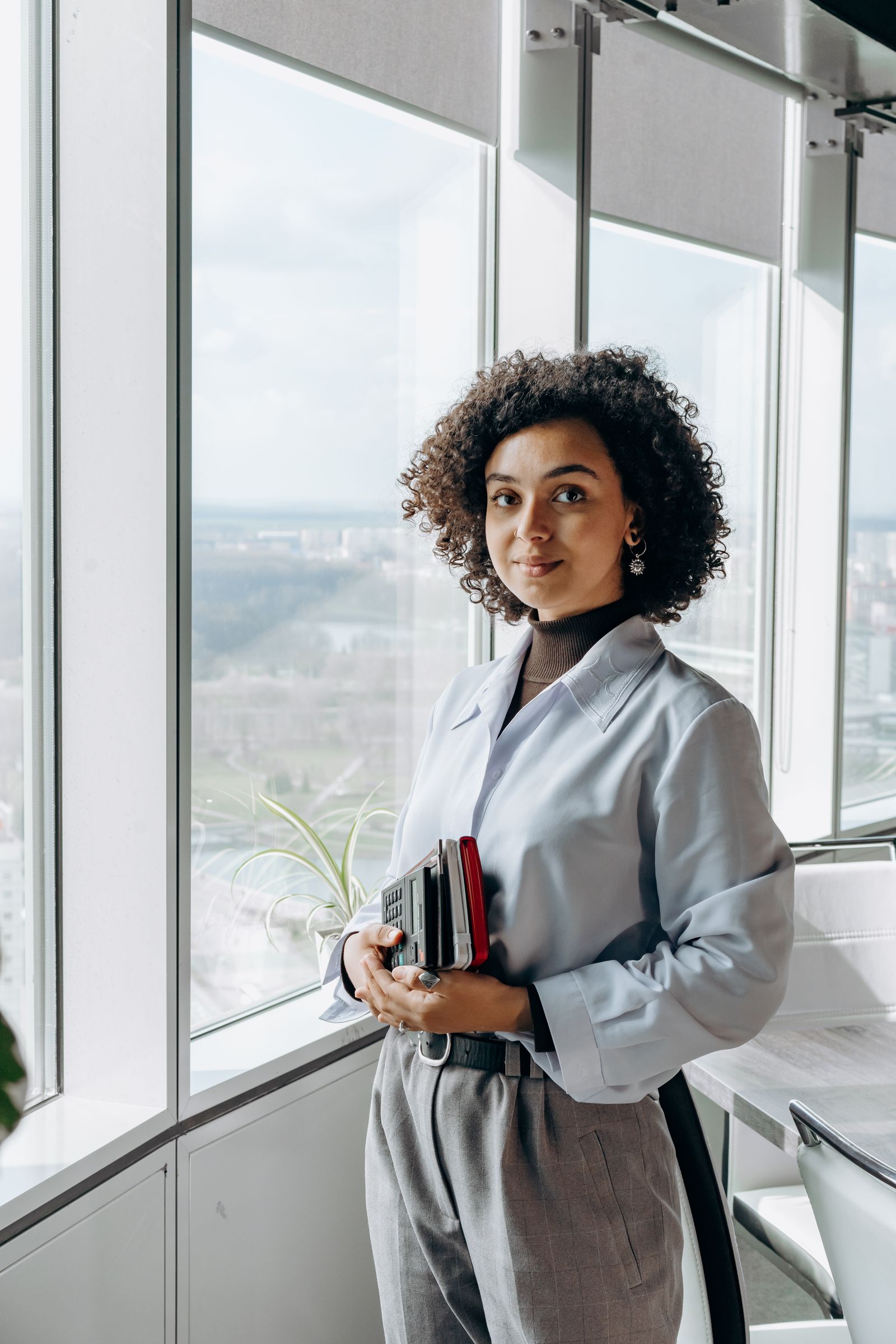 A project lead standing in a bright office