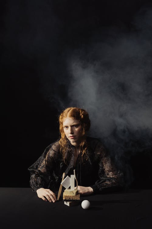 A Woman Sitting at the Table