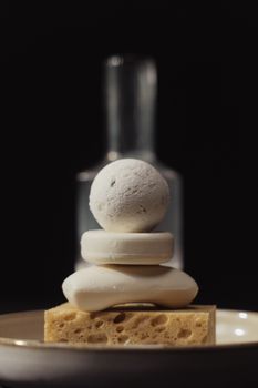 Minimalist stack of soaps and sponge with blurred background. Perfect for hygiene and organic themes.