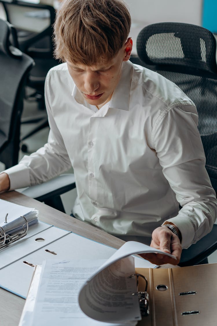 Man In A White Dress Shirt Working