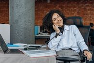 Woman in White Dress Shirt Sitting on Chair