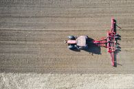 Red and Black Motorcycle on Brown Field