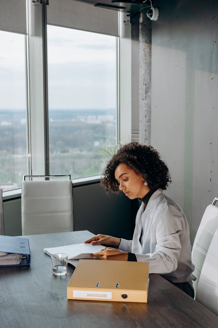 A Woman Working Inside The Office