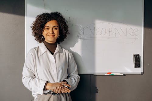 Woman Standing Near a White Board