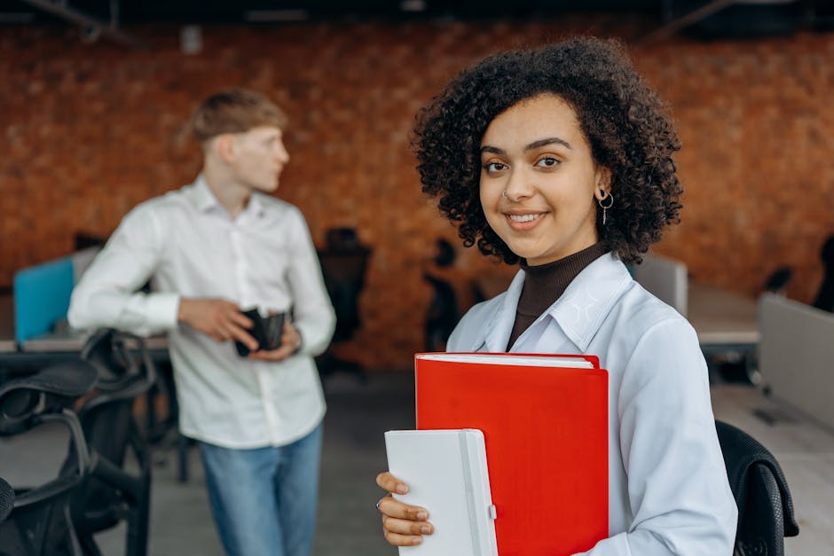 Woman in White Dress Shirt Holding White Paper