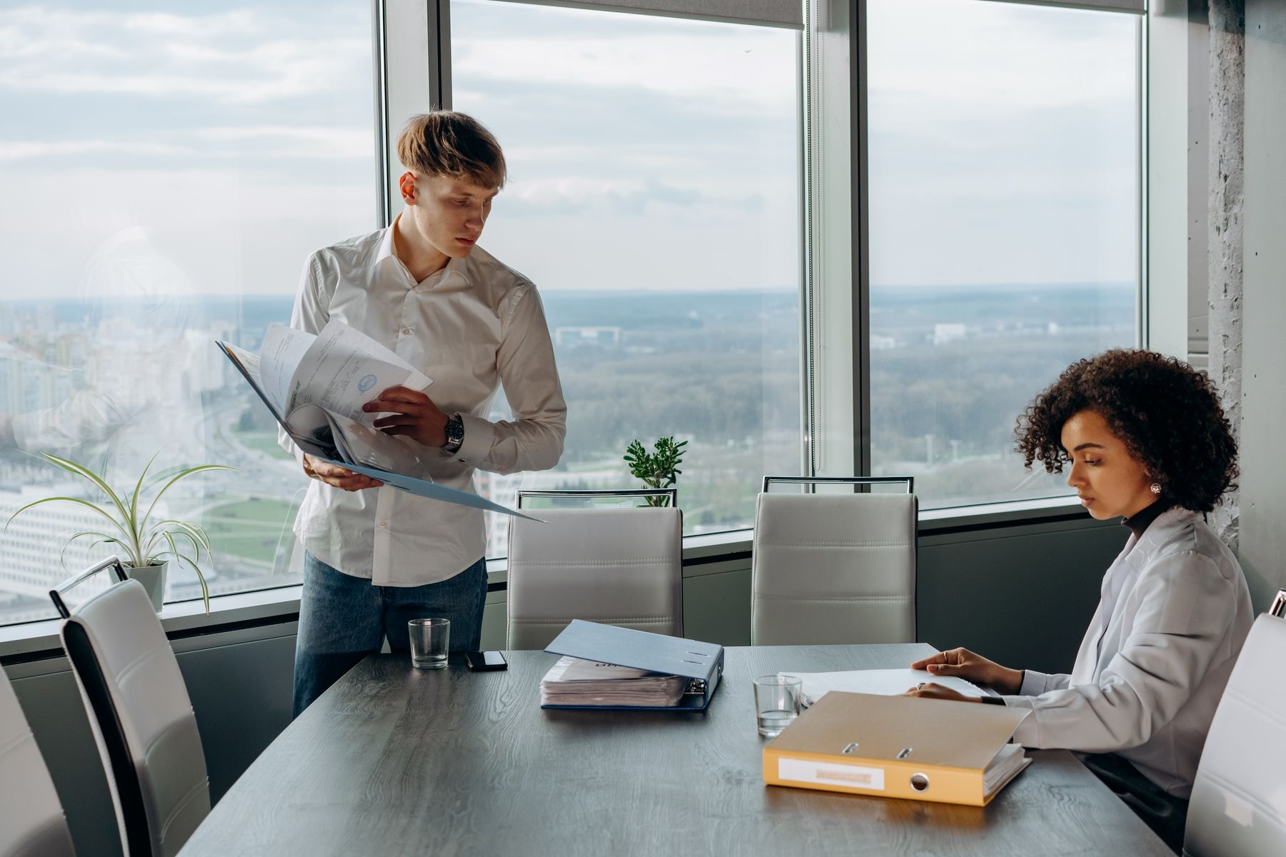 Business professionals reviewing documents in a modern office