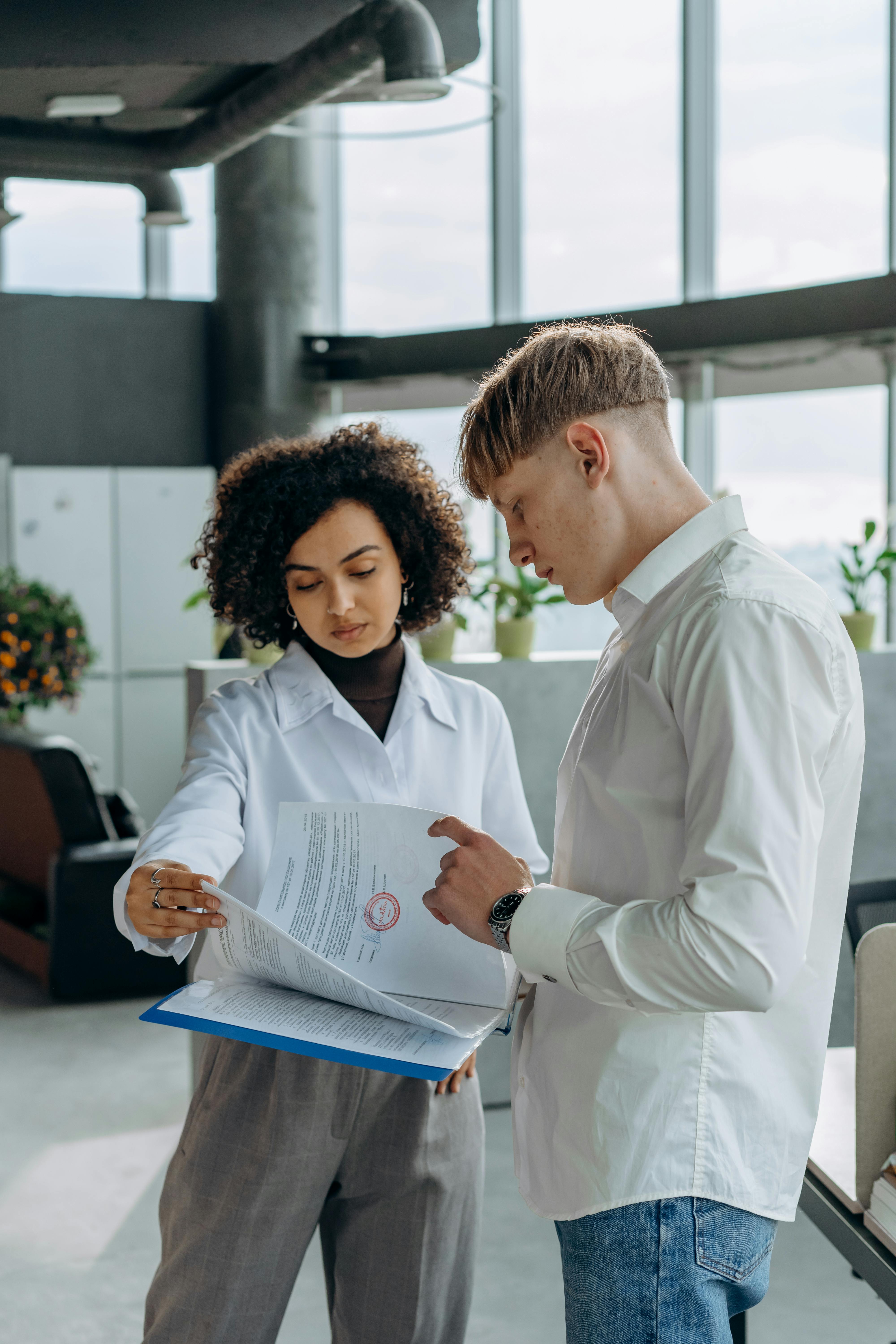 man and woman working in the office