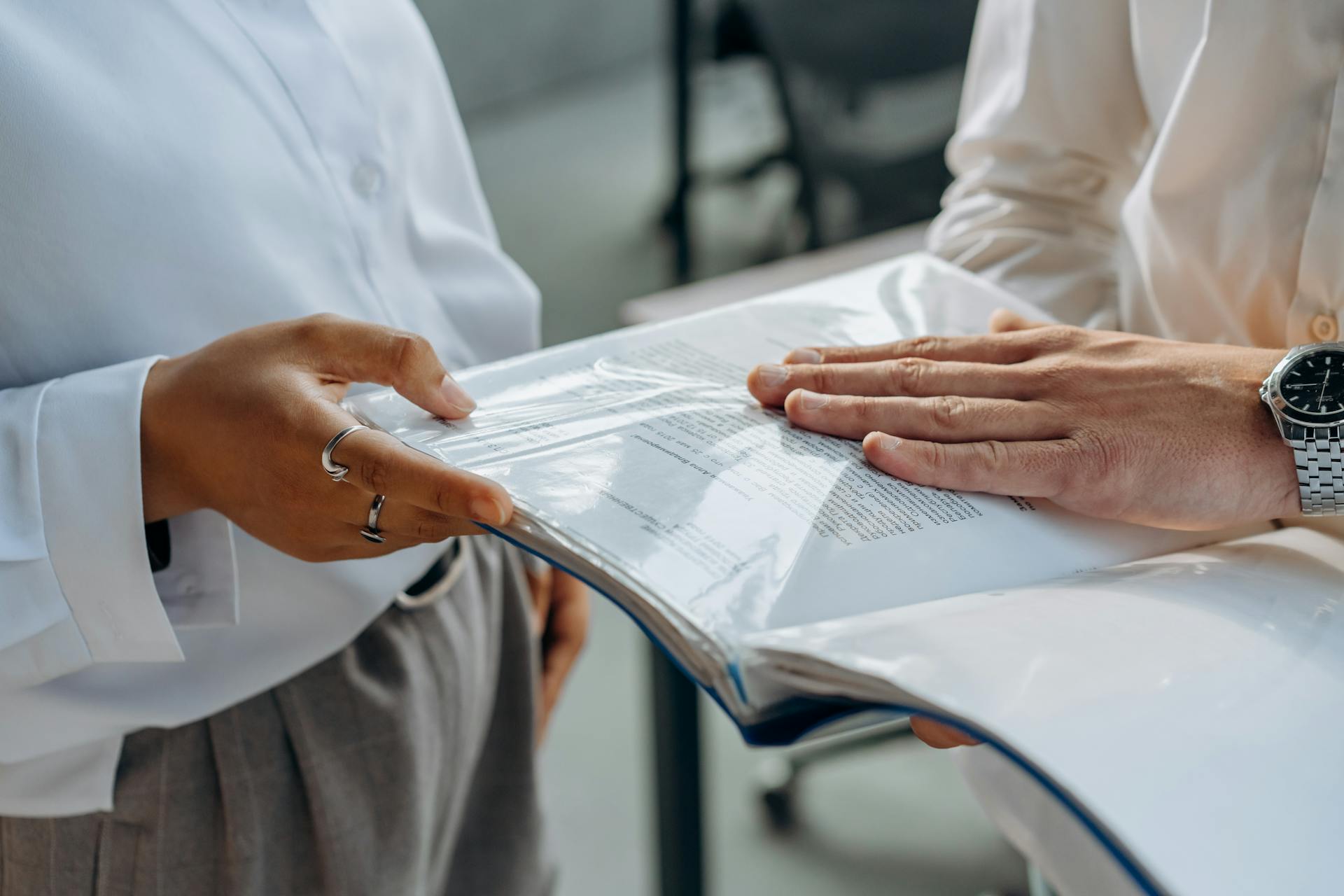 Business People Discussing About Documents