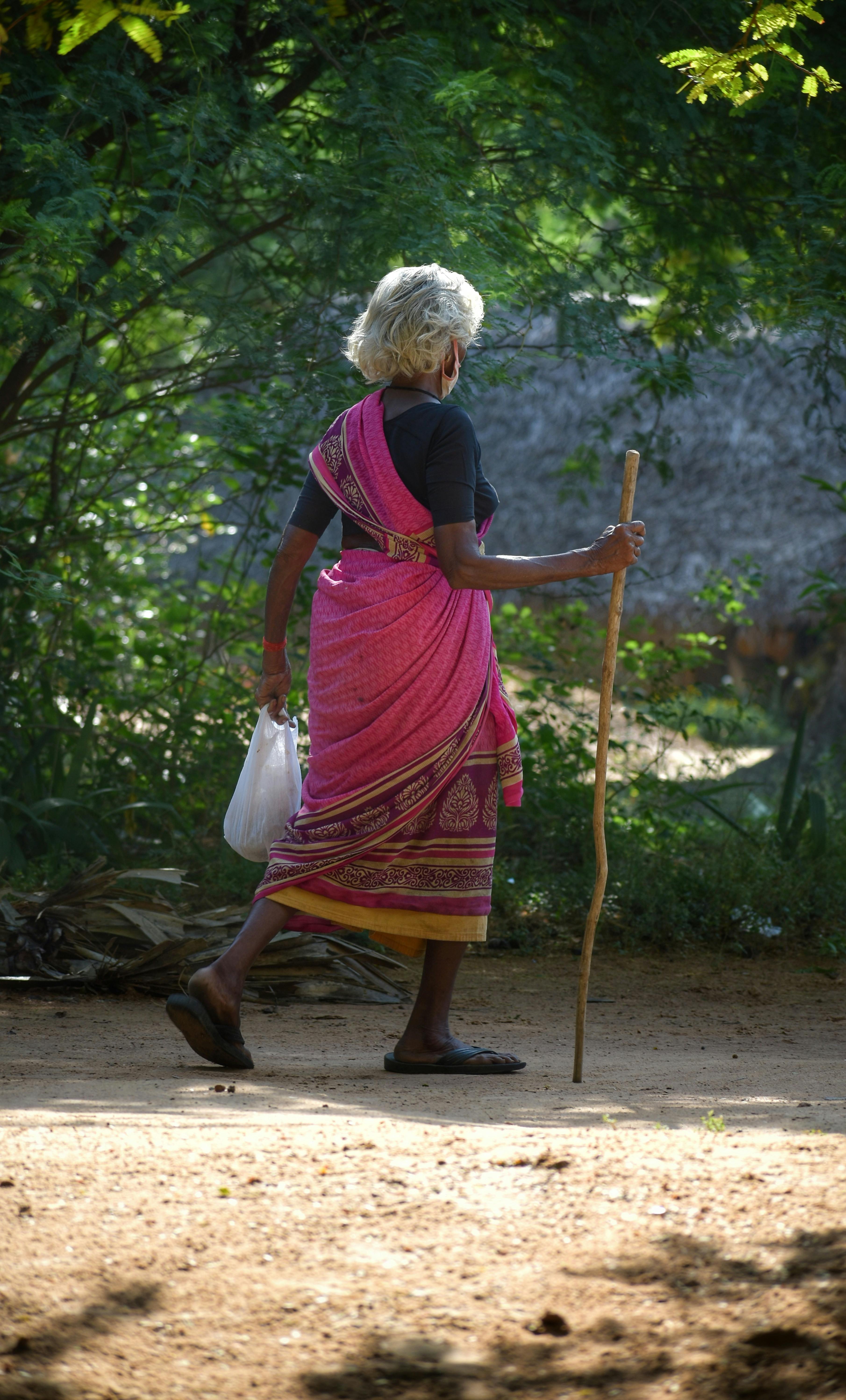 woman walking with stick