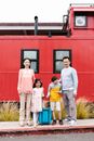 Group of People Standing Near Red Train