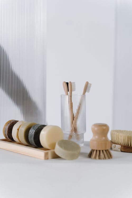 Brushes and Soap on White Surface