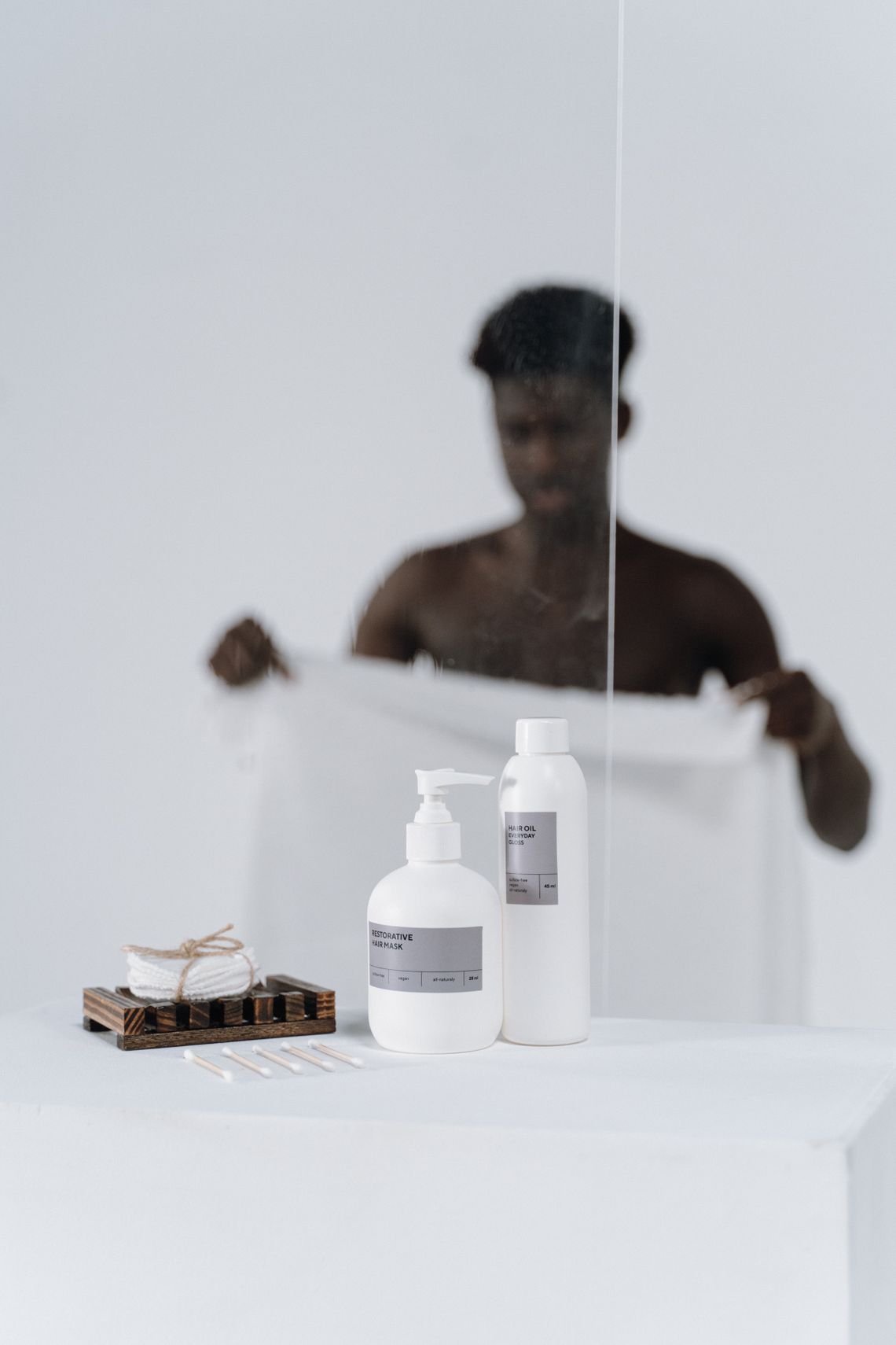 Body-care and hygiene products arranged on a modern bathroom shelf