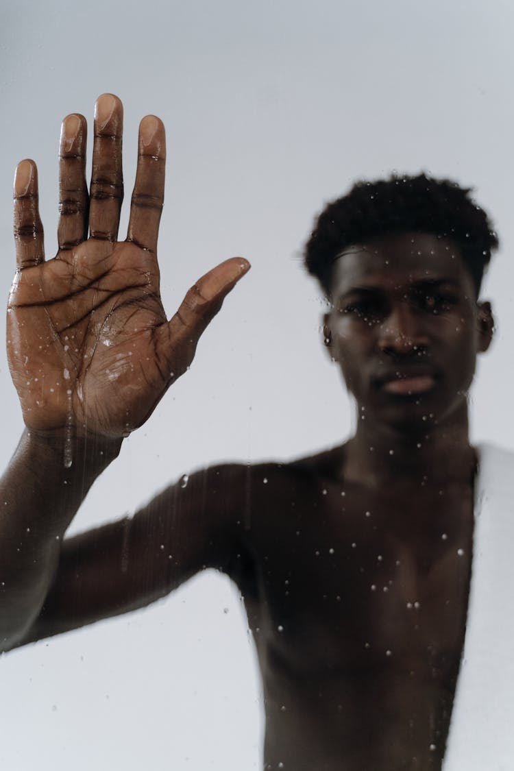 Naked Man Touching Glass In Shower