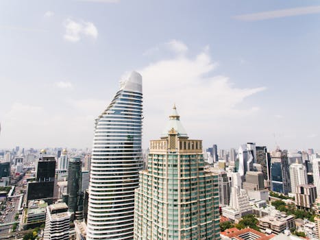 Stunning aerial cityscape showcasing modern skyscrapers in downtown Bangkok, Thailand.