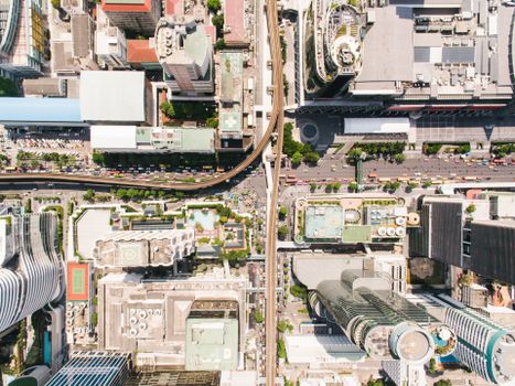 High-angle shot capturing the detailed layout of an urban city center with skyscrapers and roads.