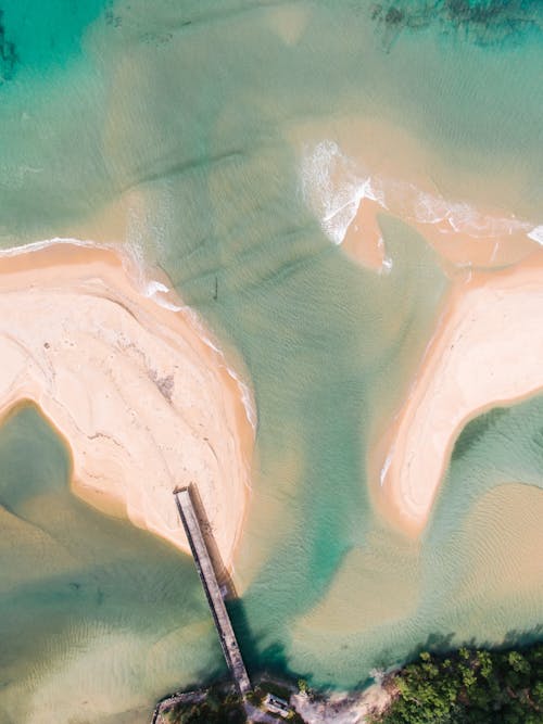 Aerial View of Exotic Beach with Pier