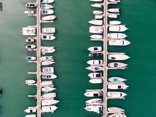 Boats on Dock on Green Sea