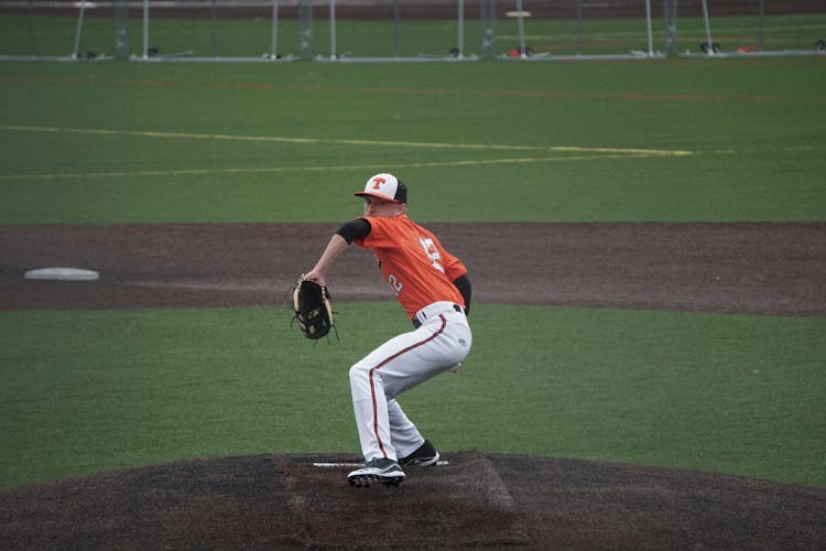 Man Throwing The Ball In Baseball 