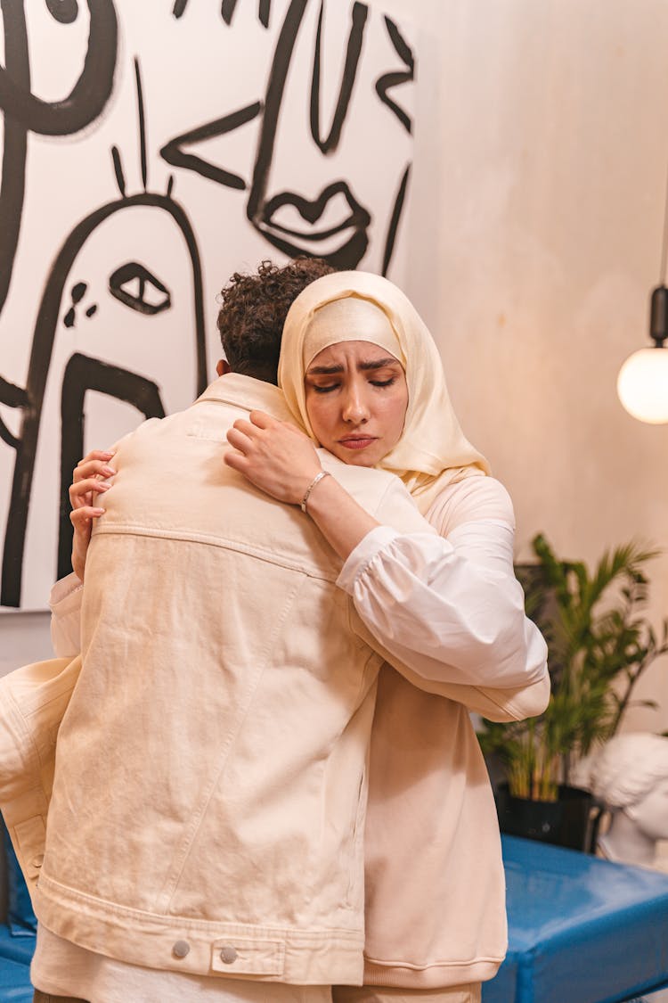 Sad Woman Hugging A Man