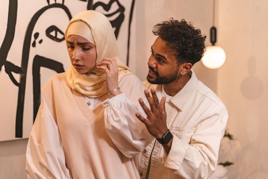 A couple having a disagreement indoors, showcasing emotions and relationship dynamics.