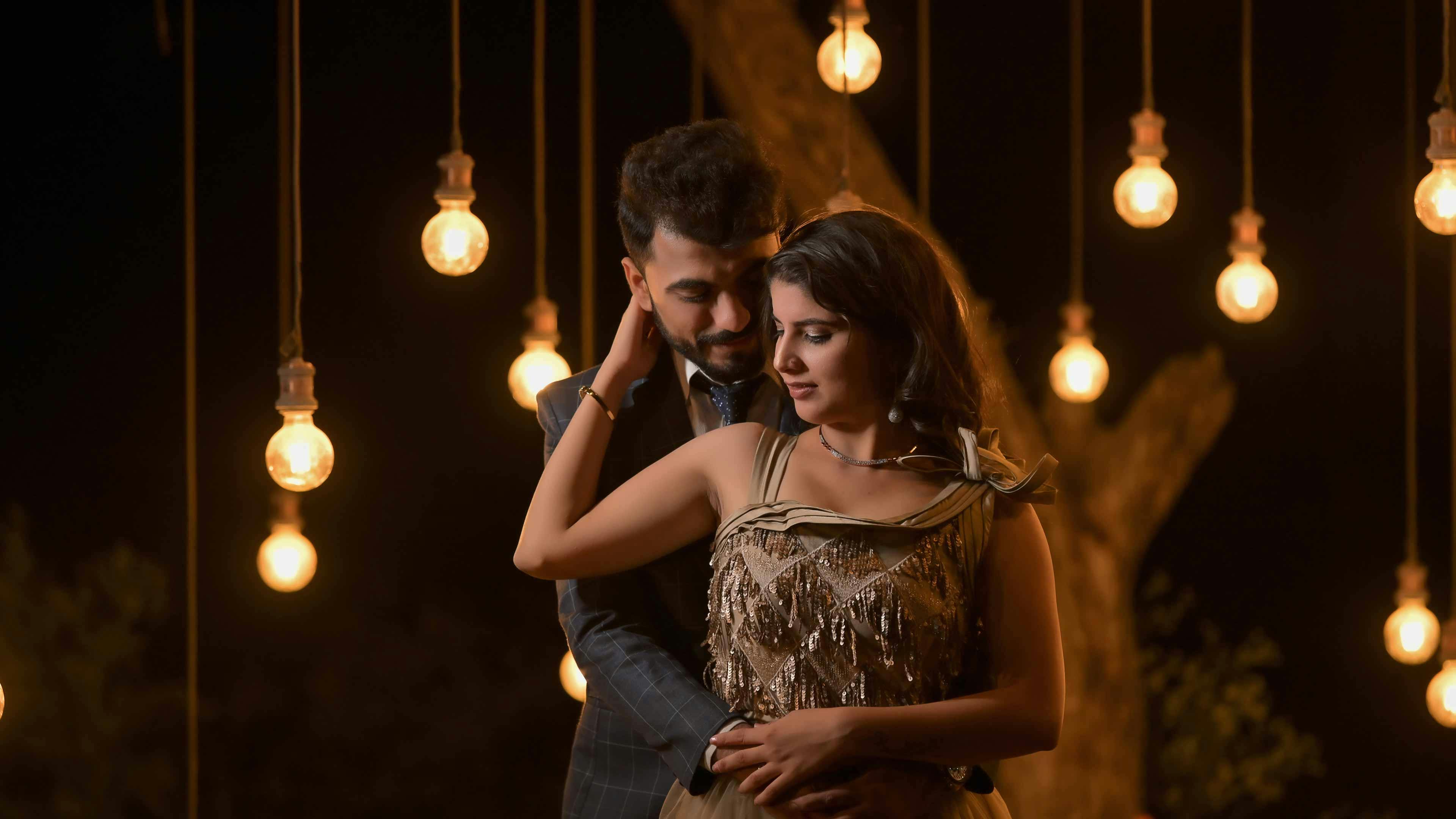 Intimate couple embrace in soft glowing light, evoking deep trusting connection and slow sensual build