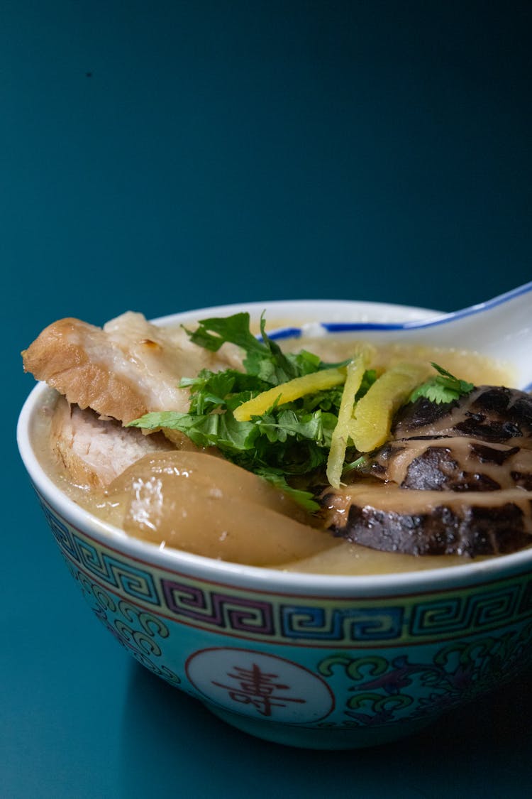 Close-Up Photo Of A Bowl With Chinese Porridge