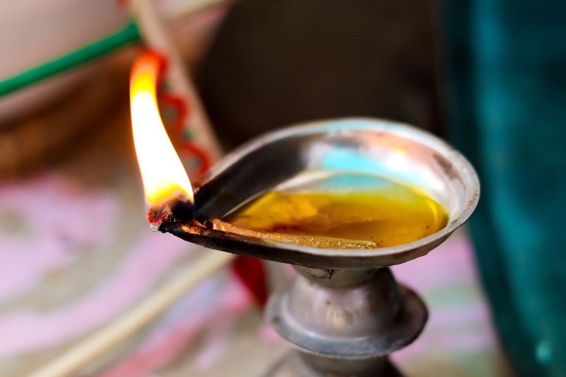A lit oil lamp