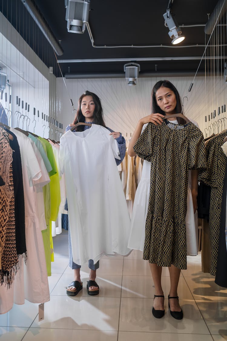 Women Shopping For Dresses At A Clothing Store