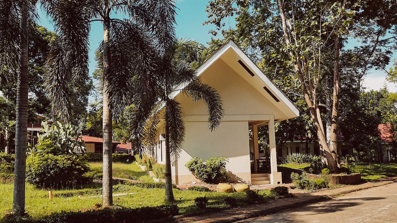 Small house as a budget housing option Small cottage exterior representing compact budget-conscious homeownership
