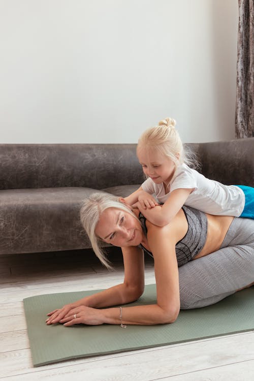 A Woman Doing Exercise with Her Grandchild