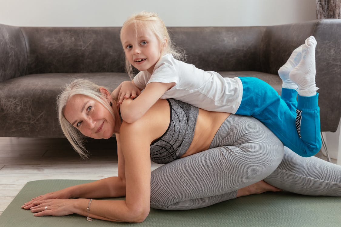 Free A Grandmother and Grandchild Doing Exercise Together Stock Photo